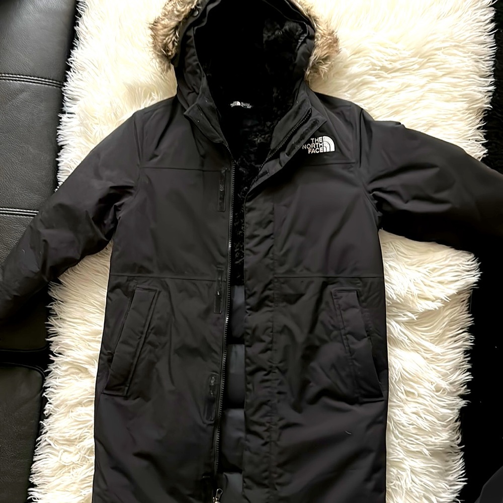 Big kids black North Face parka. Size medium 10/12. Boys or girls winter coat.